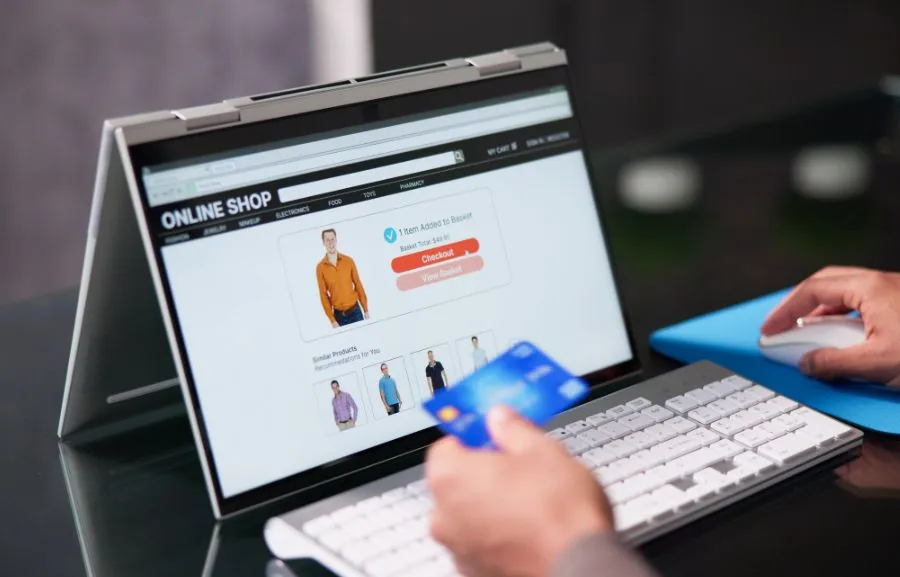 Image showing a online shopping hand and a customer's credit card.