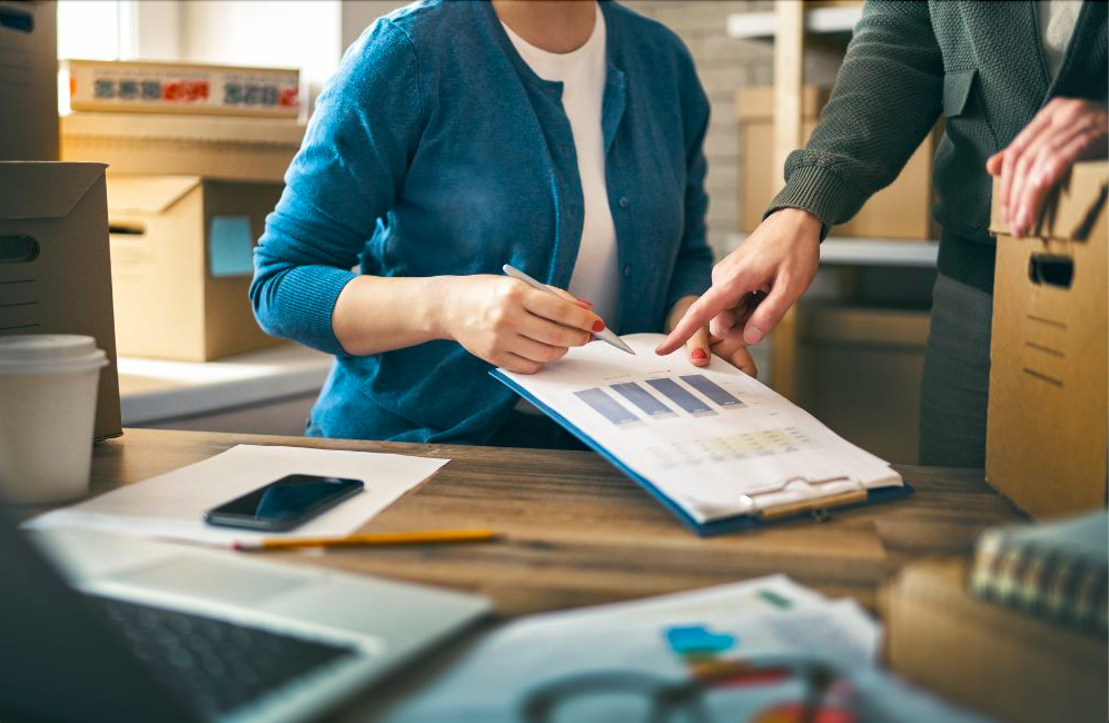 A woman employee checking the inventory forecasting statistics.