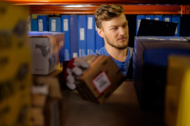 Worker on a automotive spare parts warehouse